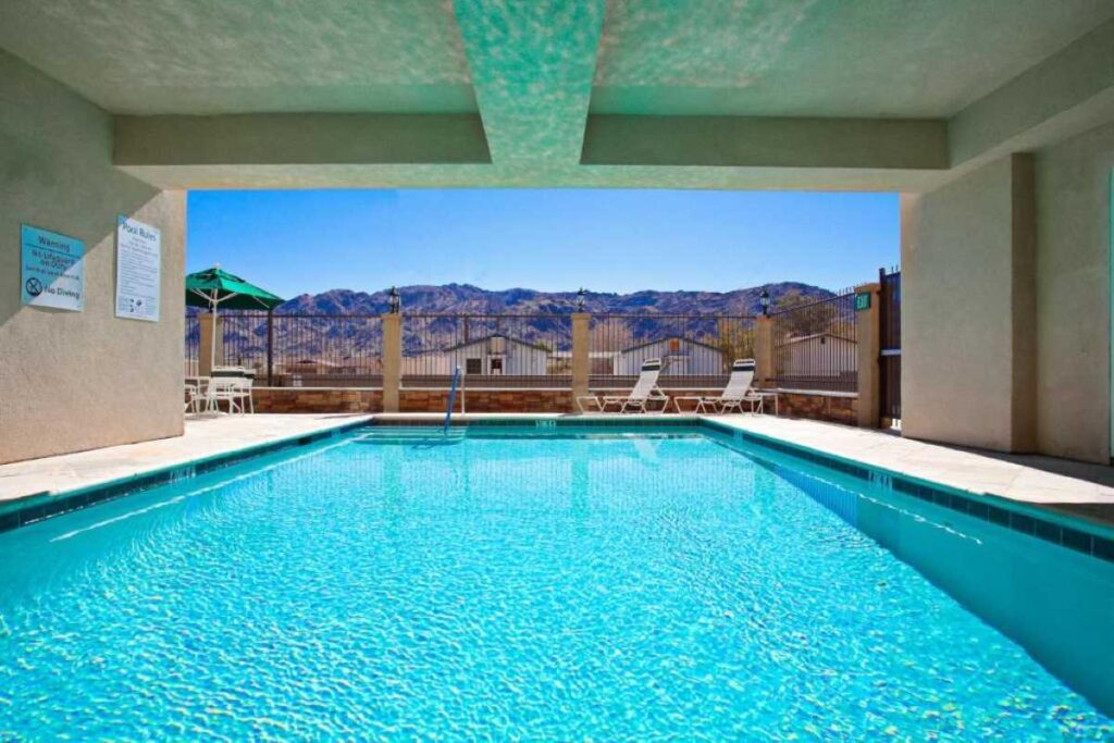 Indoor pool with scenic view at Holiday Inn Express Hotel & Suites Twentynine Palms - family hotels near joshua tree national park.