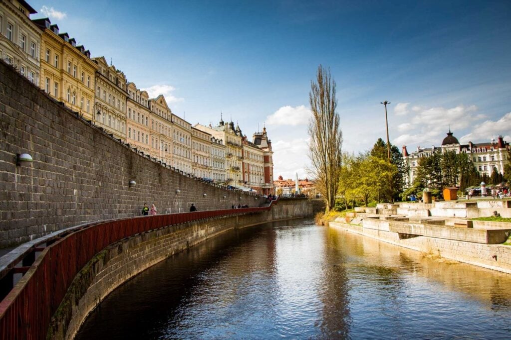 an elevated riverfront pathway in Karlovy Vary, Czech Republic.