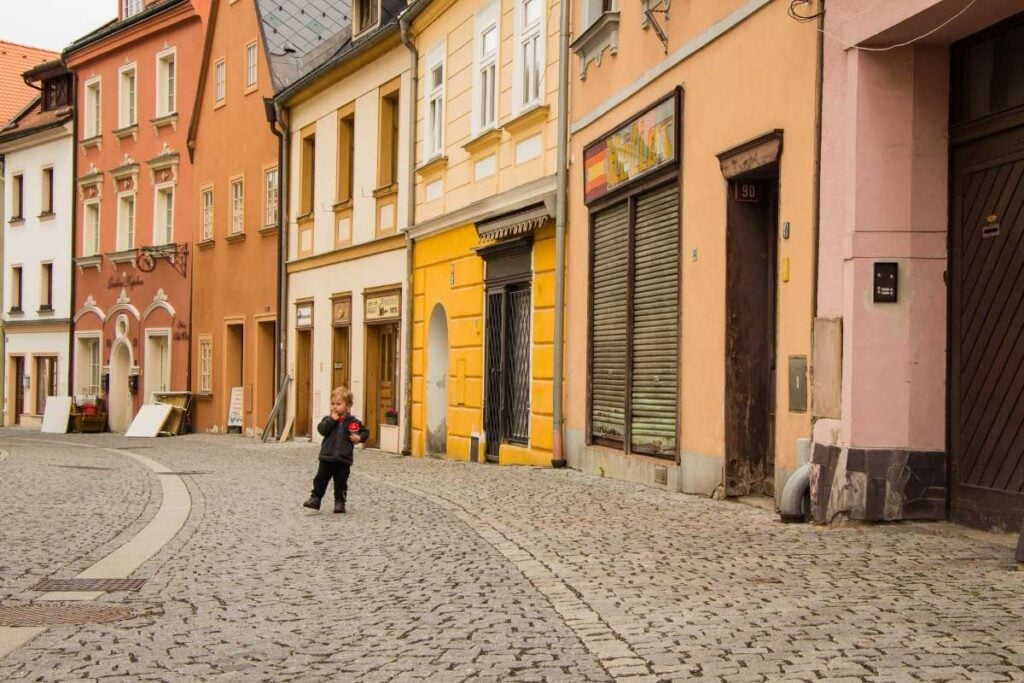 a toddler visits the colorful village of Loket on a family trip to the Czech Republic.