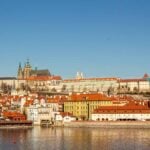 Prague with kids a beautiful view of Prague across the river.