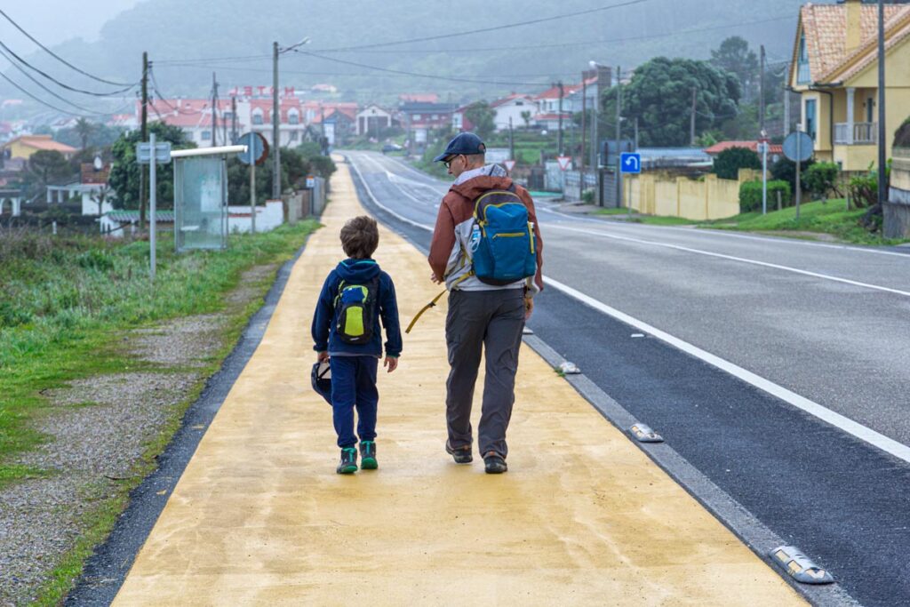Dan Brewer, owner of FamilyCanTravel.com, enjoys talking to his 8-year old son on the Portuguese Coastal Camino route.