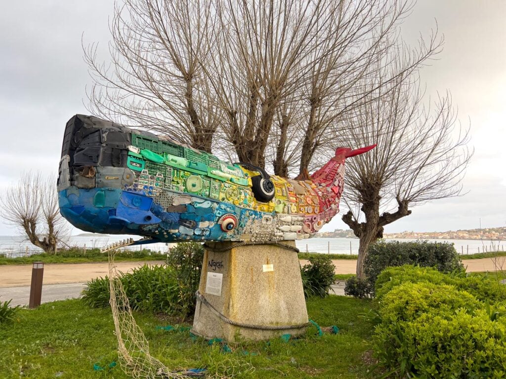 A sperm whale sculpture made entirely of plastic trash from the ocean at Praia America beach.
