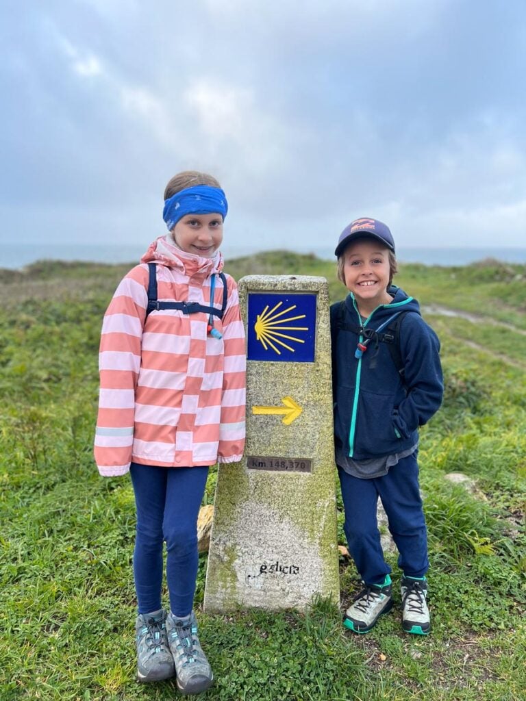 The Brewer kids, from the FamilyCanTravel.com blog, are all smiles at the very beginning of their six-day family hike on the Camino Portuguese Coastal Route.