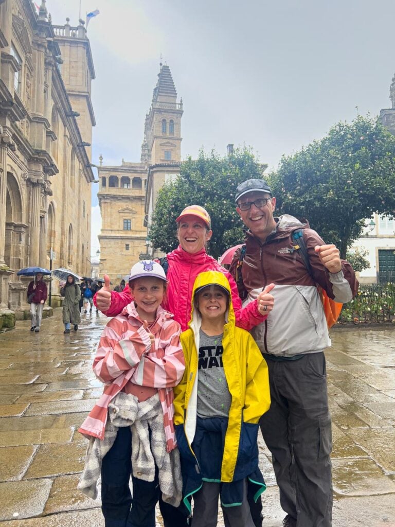 The Brewer family, from the FamilyCanTravel.com blog, celebrate successfully reaching the Cathedral of Santiago de Compostela after hiking the Portuguese Coastal Camino for six days.