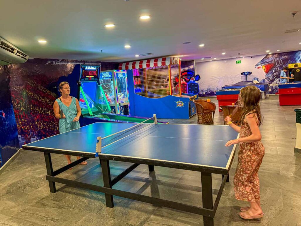 Celine Brewer plays ping pong with her daughter in the games room at the family-friendly Barcelo Huatulco resort.