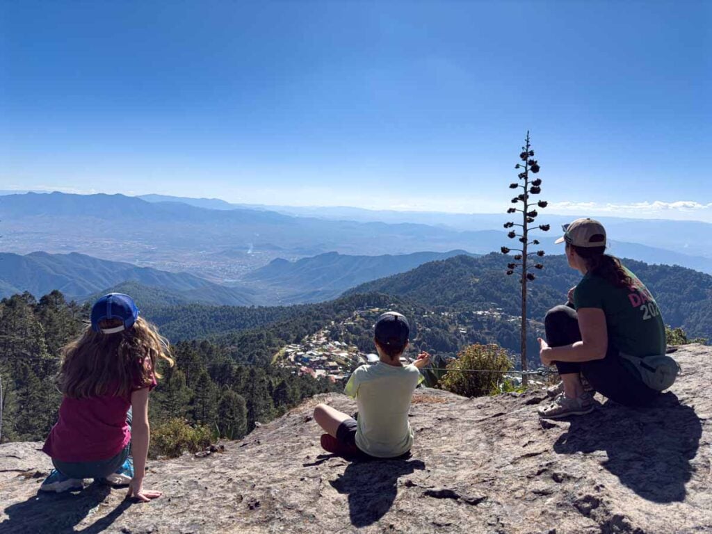 Celine Brewer, of the Family Can Travel blog, enjoys a view of the Sierra Norte Mountain while on a hiking tour with her kids.