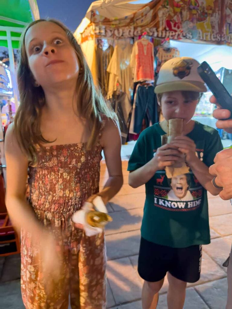 the Brewer kids from the Family Can Travel blog, react to trying a delicious Mexican dessert on a food tour of Oaxaca.