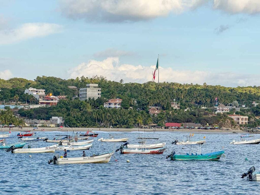 Many boats are anchored just offshore Playa Principal in Puerto Escondido, Mexico.