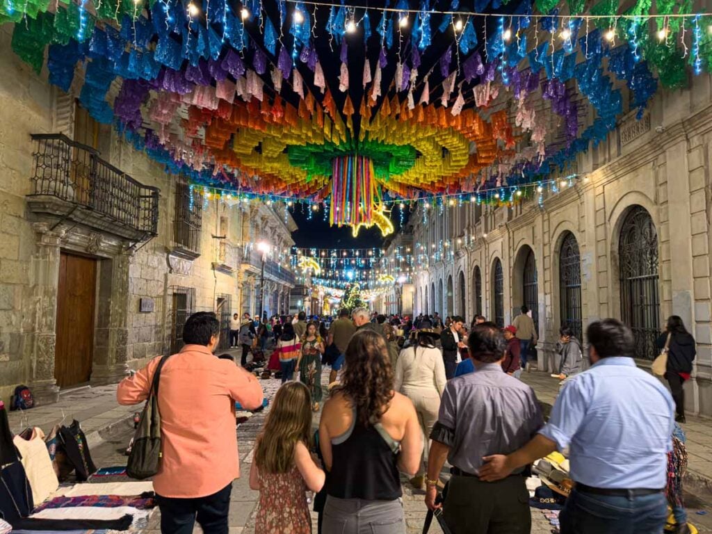 Celine Brewer, owner of FamilyCanTravel.com, enjoys a food tour of Oaxaca with her kids at night.