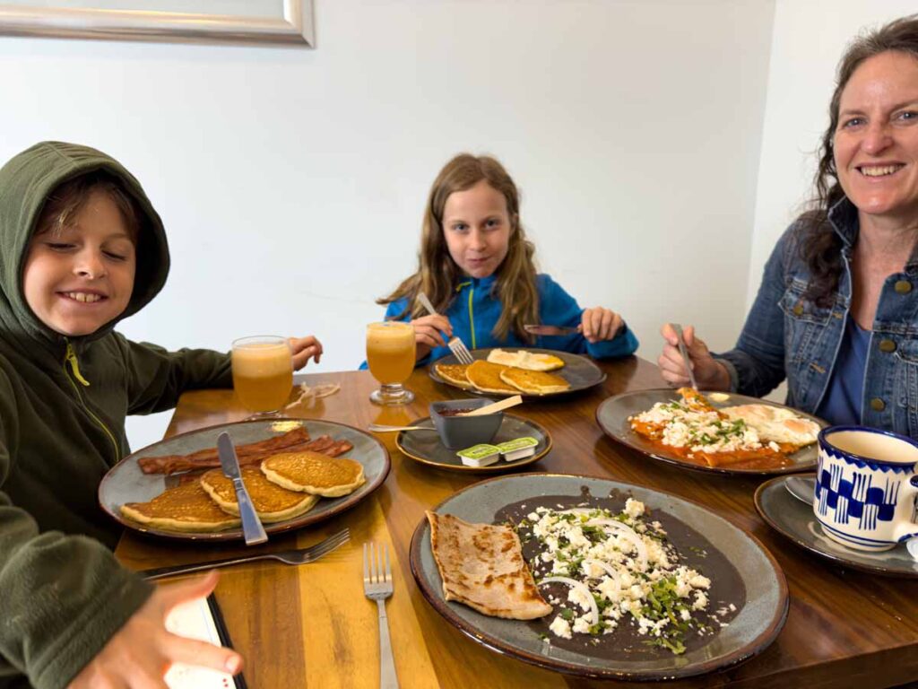 The Brewer family, from the Family Can Travel blog, enjoys breakfast in theri suite at the Suites de la Parra hotel in Oaxaca, Mexico.