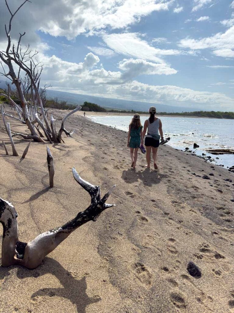 Celine Brewer walks along the beautiful Big Island coastline with her daughter in Kaloko-Honokohau National Historic Park.