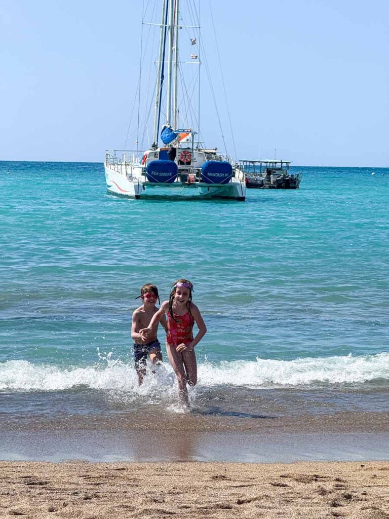 The soft sand and calm waves at ʻAnaehoʻomalu Beach make it one of the best family-friendly beaches on the Big Island of Hawaii.