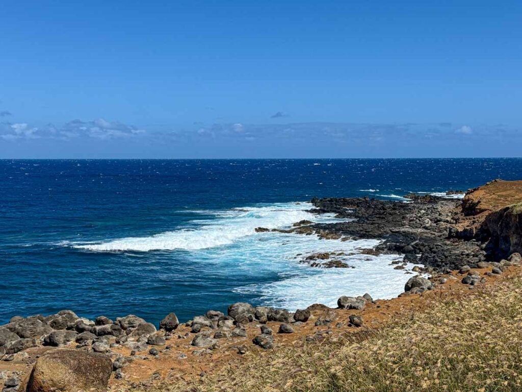 Big waves crash along the whale watching hike to Moโokini Heiau on the Big Island.