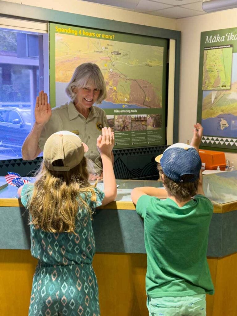 The Brewer kids, from the Family Can Travel blog, take the oath after earning their Junior Ranger badges at Hawaii Volcanoes National Park on the Big Island.