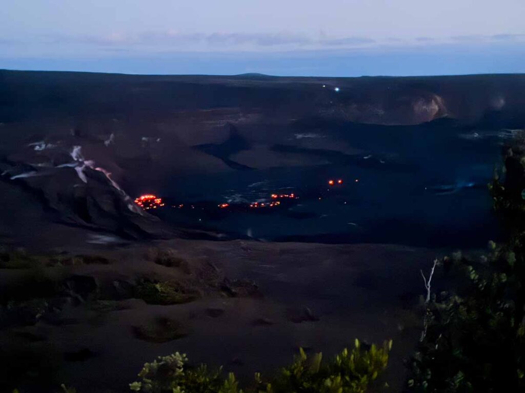 The floor of the Halemaʻumaʻu Crater glows red at night after a recent eruption of the Kīlauea Volcano.