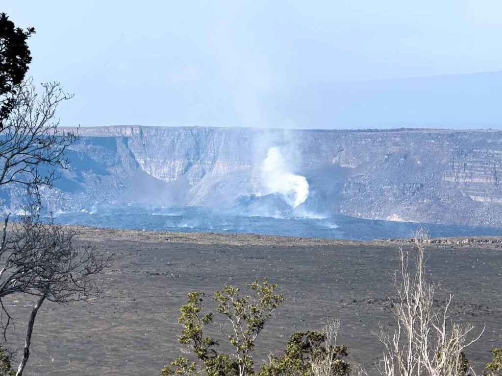 The eruptive vent of Kฤซlauea as seen from a hiking trail in the Halemaสปumaสปu Crater.