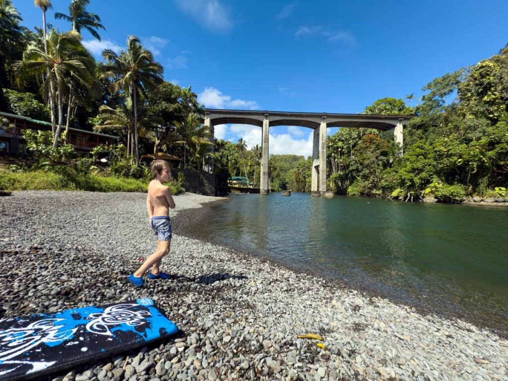 The tranquil river flowing into the ocean makes Honoli'i Beach Park one of the best beaches for families on the Big Island of Hawaii.