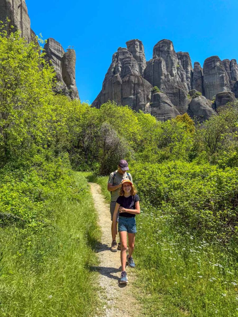 An 1--year old girl is all smiles at the end of her first day of hiking around the monasteries of Meteora, Greece.