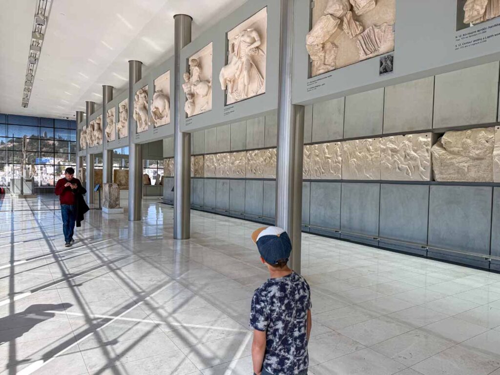 a 9-yearr old boy visits the Acropolis Museum on a family vacation to Athens, Greece.