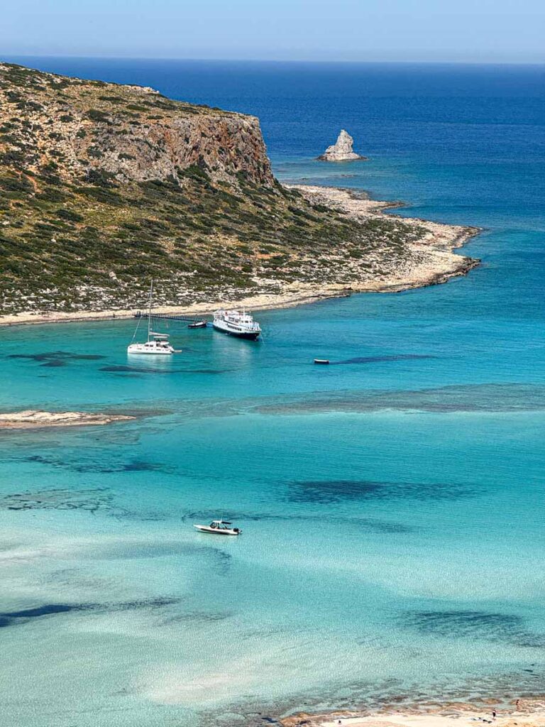 Tour boats in the water at Balos Beach, Crete, Greece.