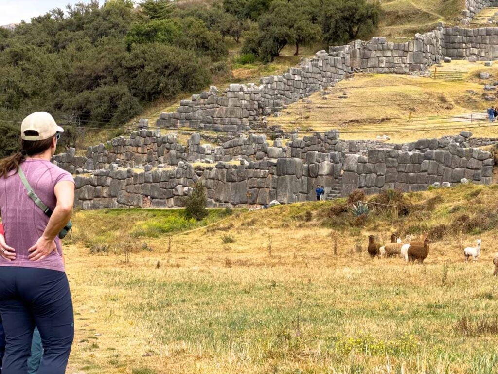 Celine Brewer, of the Family Can Travel blog, visits the Saqsaywaman Inca ruins while on a family hike near Cusco, Peru to help acclimatize to the high altitude.
