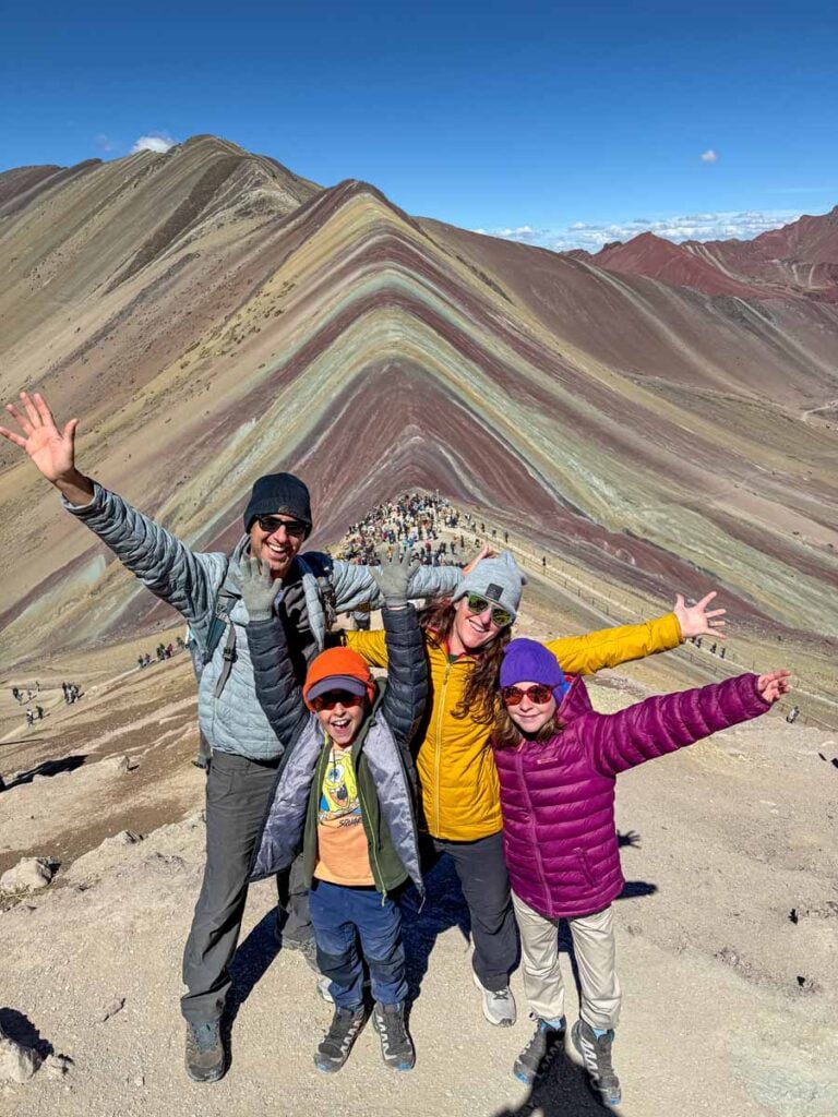 The Brewer family visits the highest viewpoint for Rainbow Mountain to get away from the crowds.