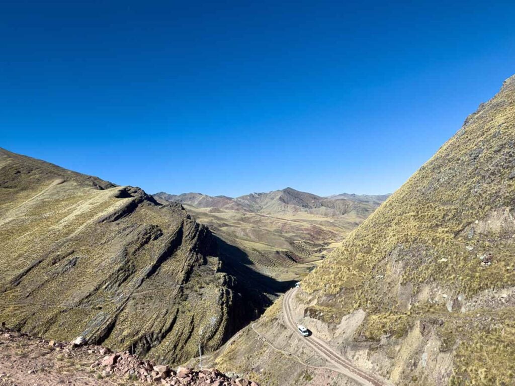 the winding mountain road leading to Rainbow Mountain in Peru.