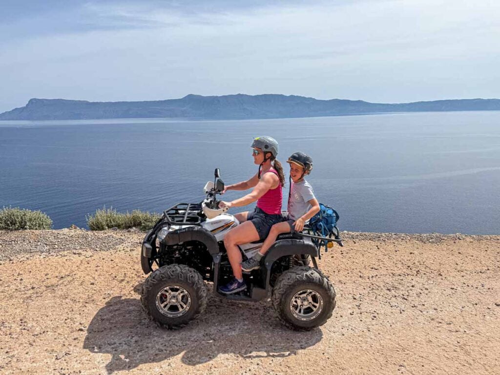 Celine Brewer, owner of FamilyCanTravel.com, rides an ATV with her son to Balos Beach during a family trip to Crete, Greece.