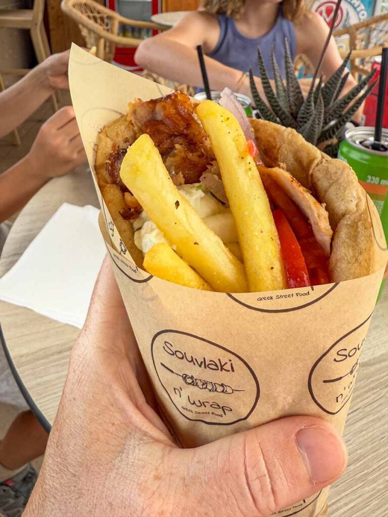 A pita wrap is a kid-approved lunch option while traveling in Greece with kids.
