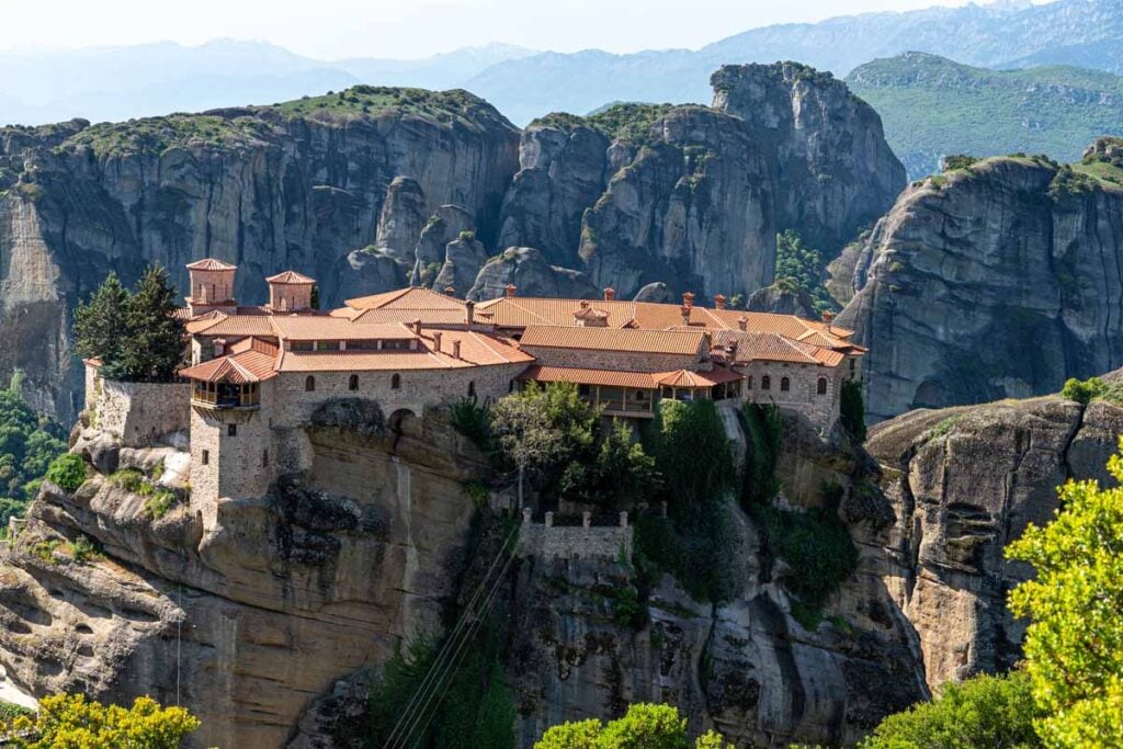 The Grand Meteoron Monastery seen from a hiking trail in Meteora, Greece.