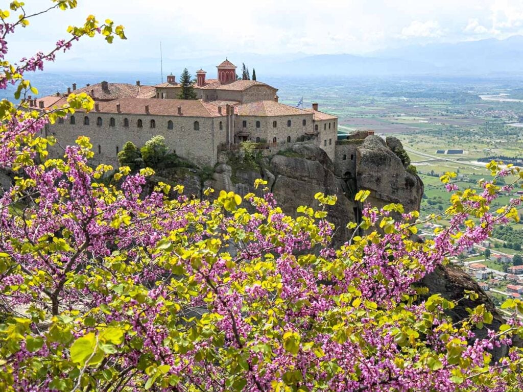 Beautiful flowers surround the Monastery of St. Stephen in Meteora, Greece.