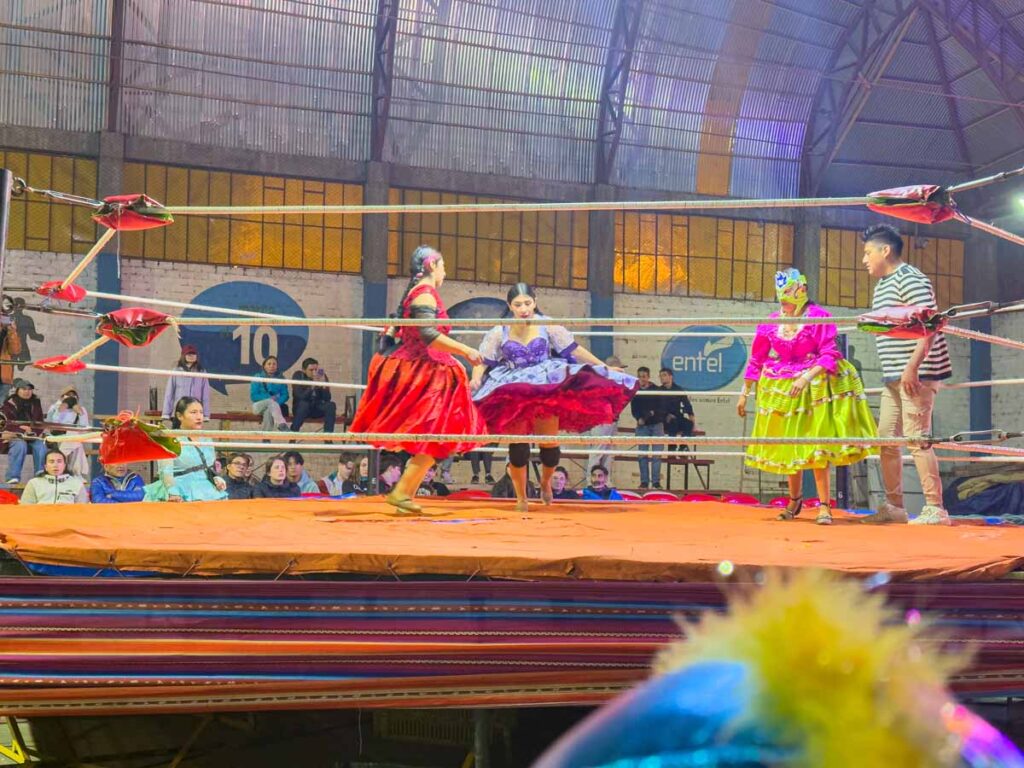 watching colorfully dressed Cholitas wrestlers is one of the best things to do in La Paz, Bolivia with kids.