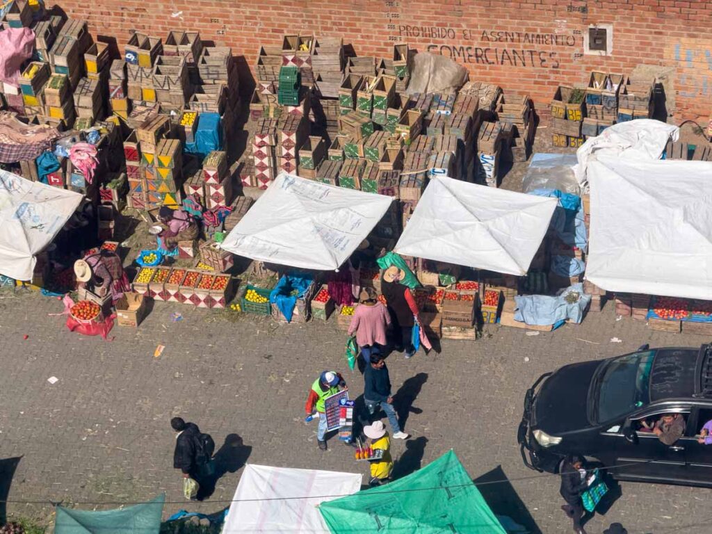 a vibrant street market in La Paz, Bolivia as seen from a cable car on the Silver line.