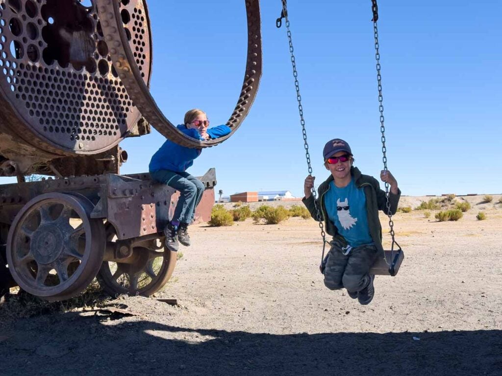 The Brewer kids from the Family Can Travel blog, enjoy visiting the Train Cemetery on a family trip to Bolivia.
