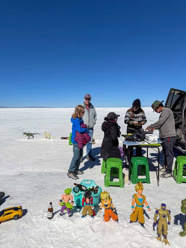 The Brewer family, from the Family Can Travel blog, buys a forced perspective picture from a professional photographer at the Uyuni Salt Flats in Bolivia.
