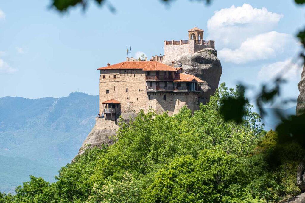 The Varlaam Monastery seen through the trees from a hiking trail below.