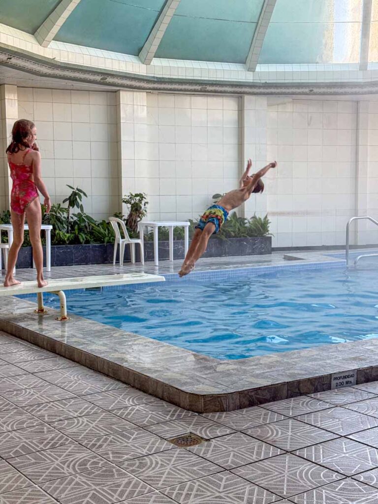 The Brewer kids, from the FamilyCanTravel.com blog, enjoy some fun time in the indoor swimming pool at the Hotel Presidente in La Paz, Bolivia.