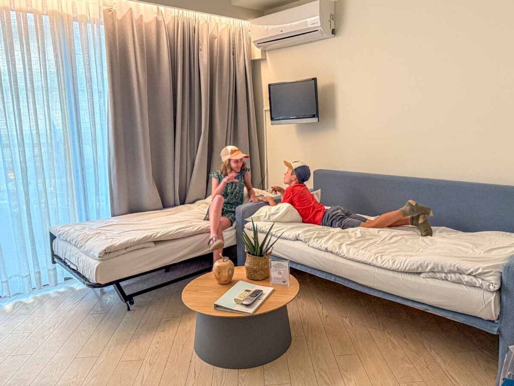 The Brewer kids have fun on their beds in the family-friendly Steris Elegant Beach Hotel on Crete, Greece.