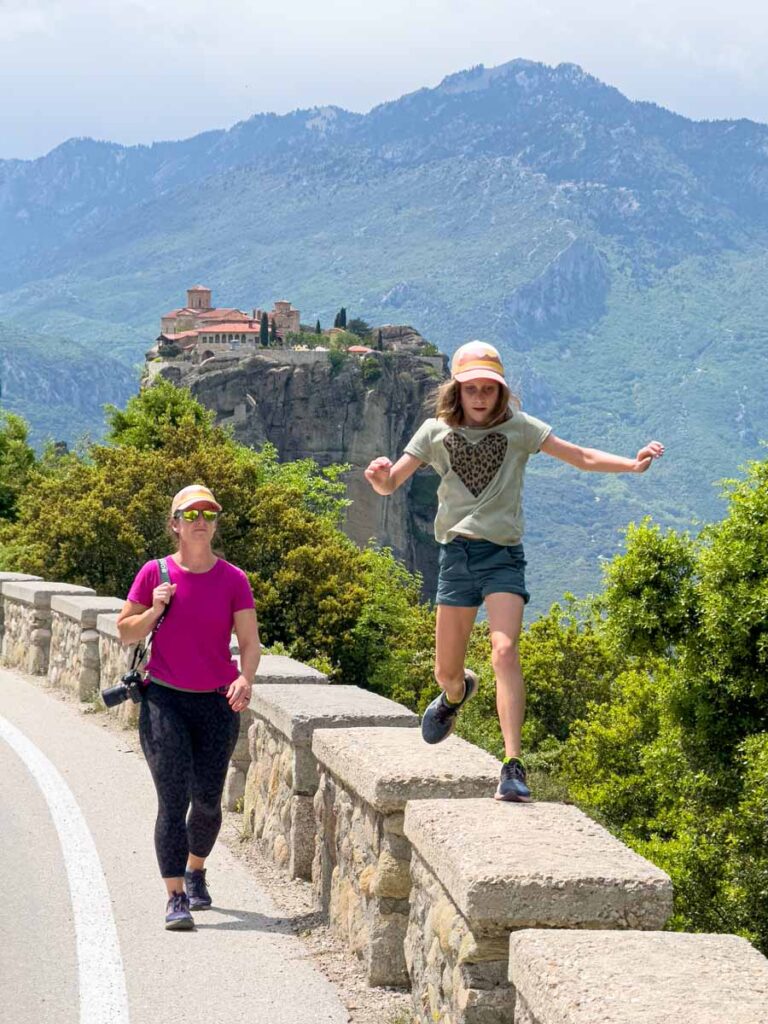 An 11-year old girl has fun on a family hiking trip to Meteora, Greece.