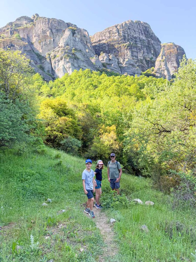 Dan Brewer, owner of the Family Can Travel blog, is hiking with his kids during a 2-day trip to Meteora, Greece.