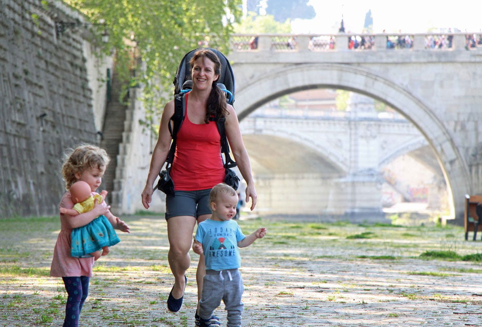 Celine Brewer, owner of FamilyCanTravel.com, enjoys a safe family walk along the river during a family trip to Rome, Italy.