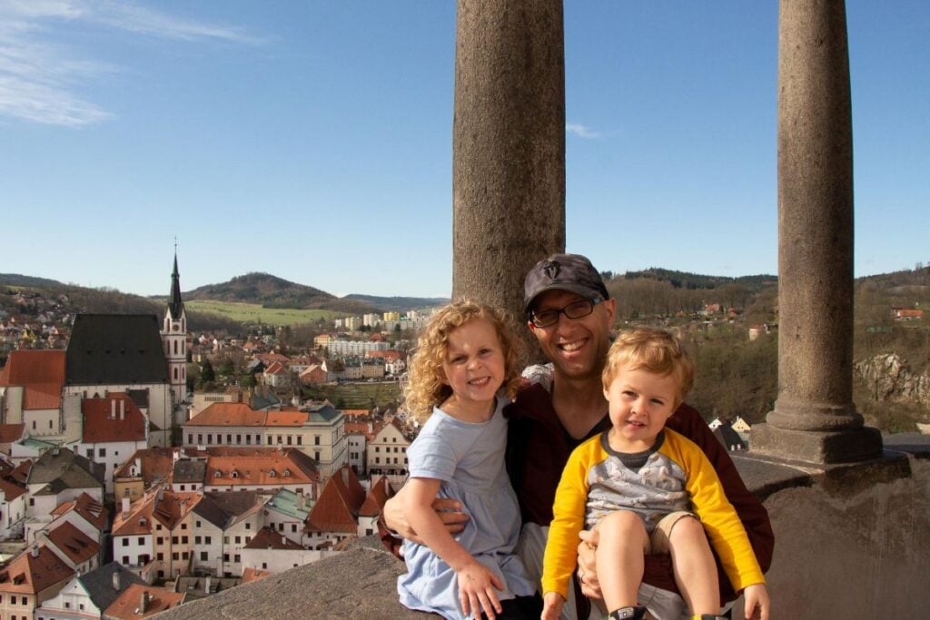 Dan Brewer, owner of FamilyCanTravel.com, what to do in Cesky Krumlov with kids - climbs the Cesky Krumlov Tower with his kids.