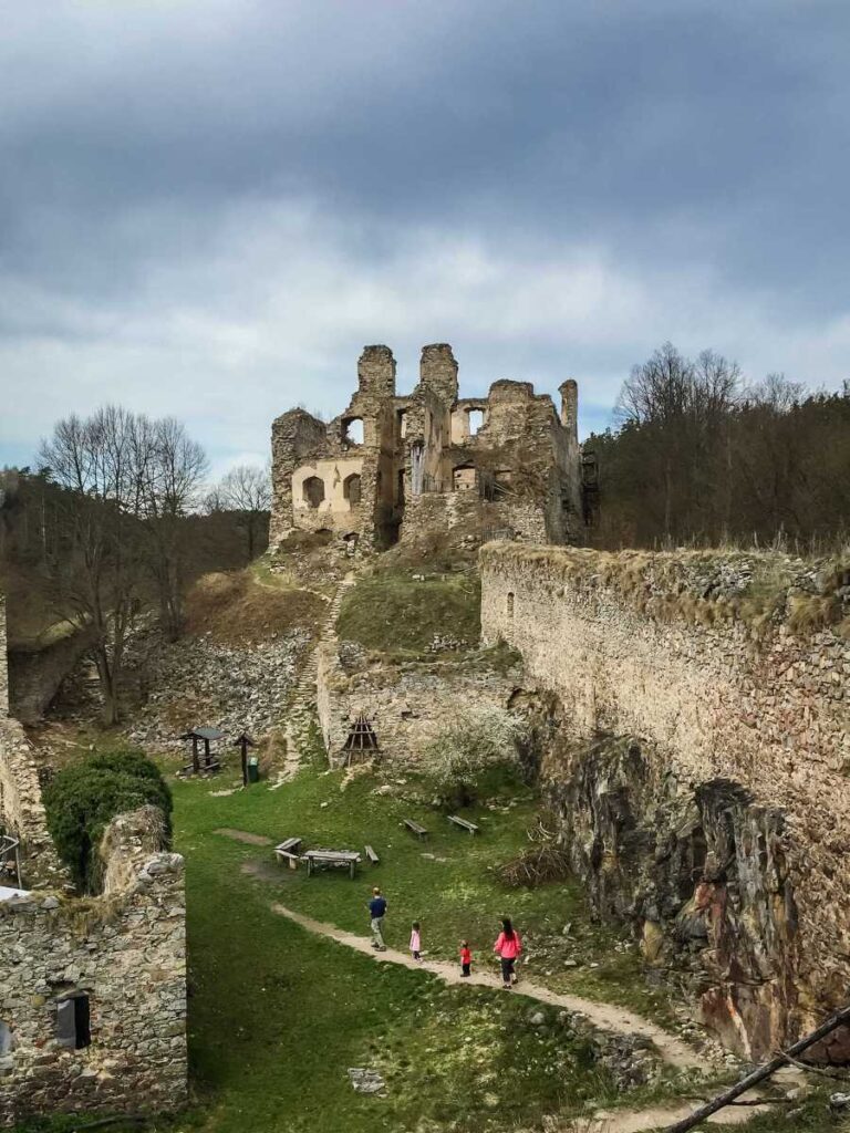 Dan and Celine Brewer, owners of FamilyCanTravel.com, explore the Divci Kamen castle ruins while on a family trip to Cesky Krumlov.