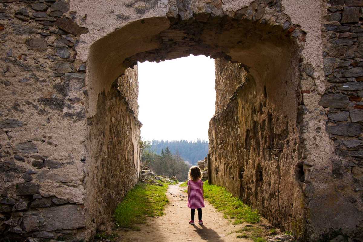 a 4-year old girl from the FamilyCanTravel.com blog, explores the Divci Kamen Castle on a day trip from Cesky Krumlov.