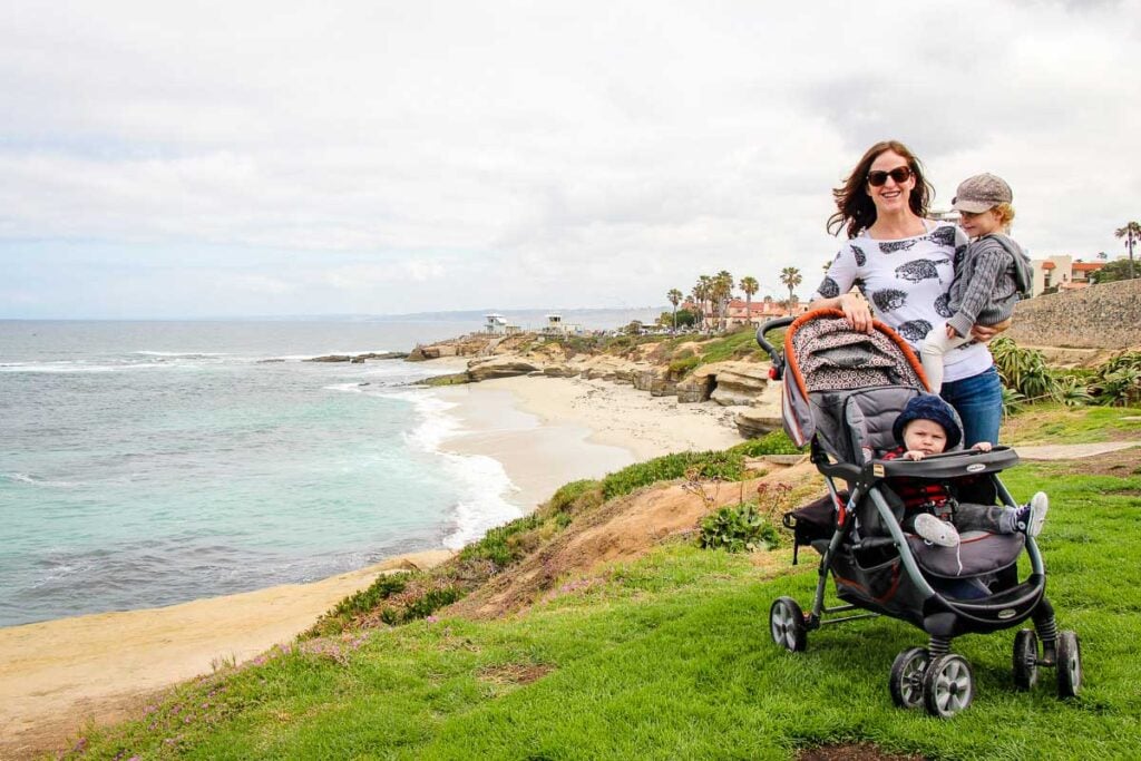 Celine Brewer, owner of FamilyCanTravel.com, enjoys an oceanfront walk in La Jolla, during a family trip to San Diego, California.