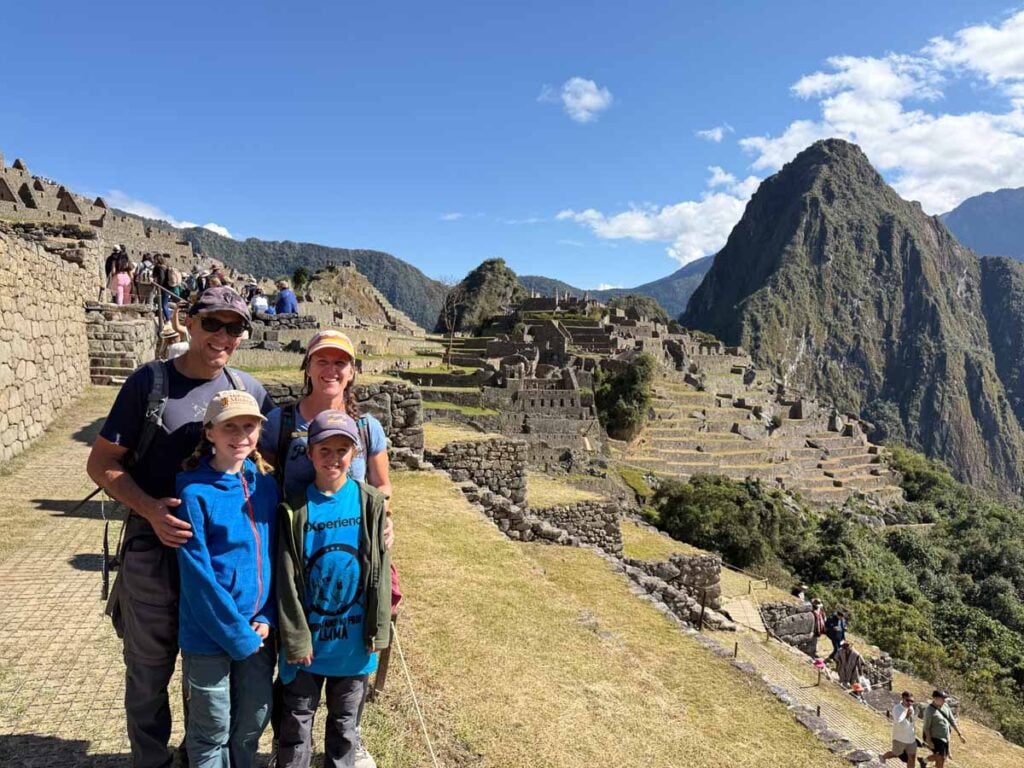 Dan and Celine Brewer, owners of FamilyCanTravel.com, visit Machu Picchu after hiking the Inca Trail with kids for 4 days.