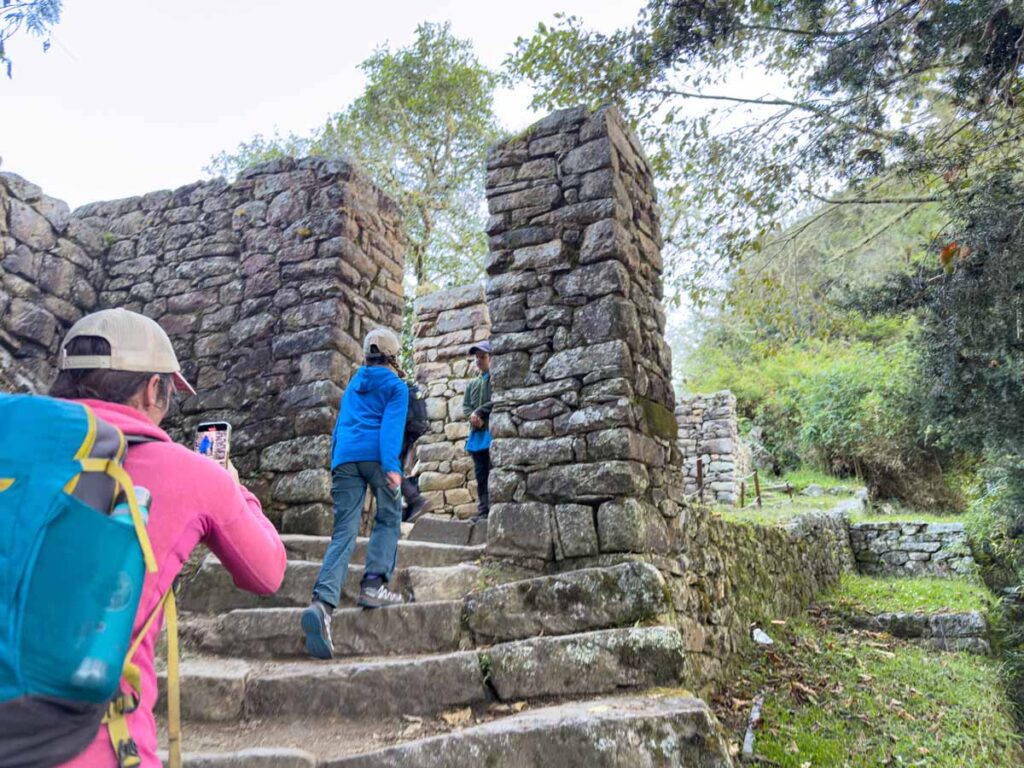 An 11-year old girl walks though the Sun Gate on the last day of her family adventure on the Inca Trail.