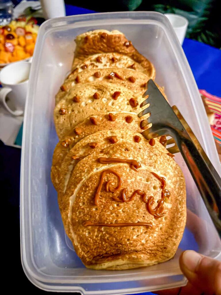 On our second day of hiking the Inca Trail with kids, we were served pancakes with the word "Peru" written on them in dulce de leche.