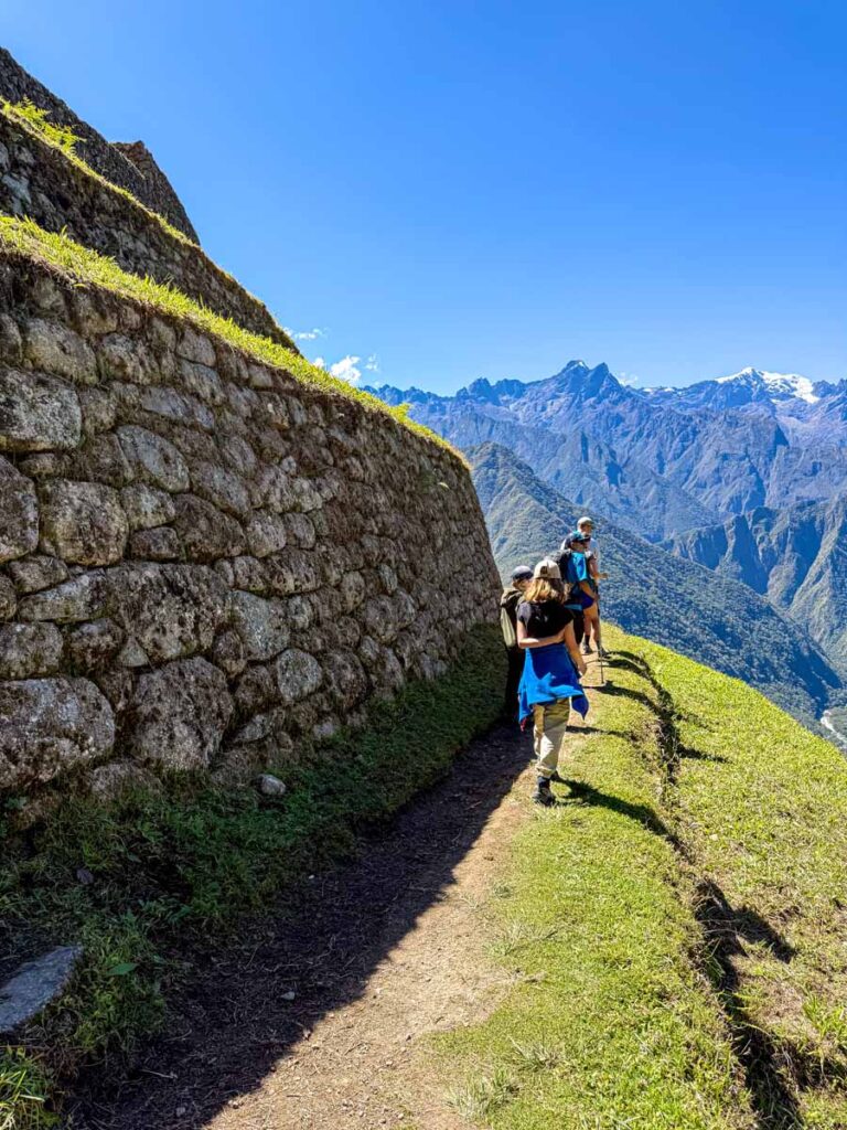an 11-year old girl hikes through the Intipata Sun Terraces on Day 3 of her family trip to the Inca Trail to Machu Picchu.