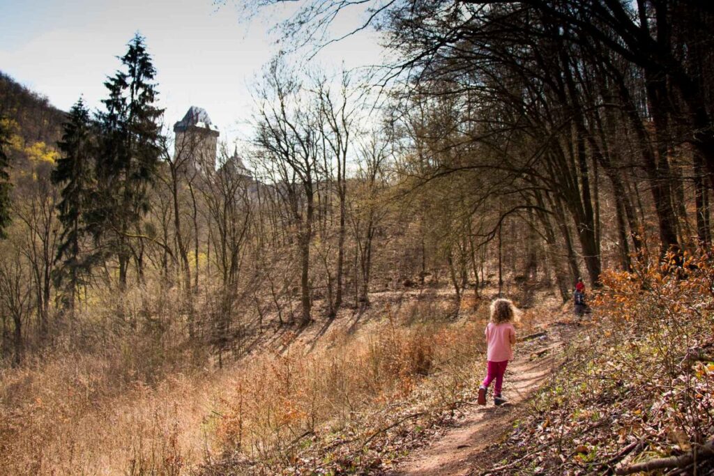 The Brewer kids, from the FamilyCanTravel.com blog, enjoy a family hike near Karlstejn Castle near Prague.